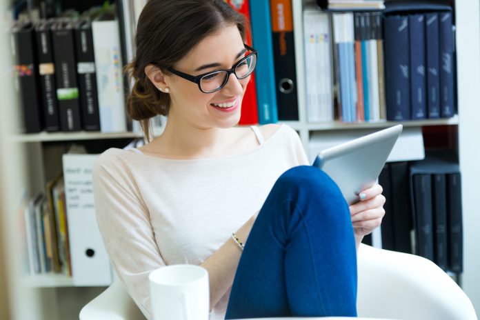 Young worker woman with digital tablet in her office